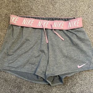 Gray and pink Nike shorts. Medium